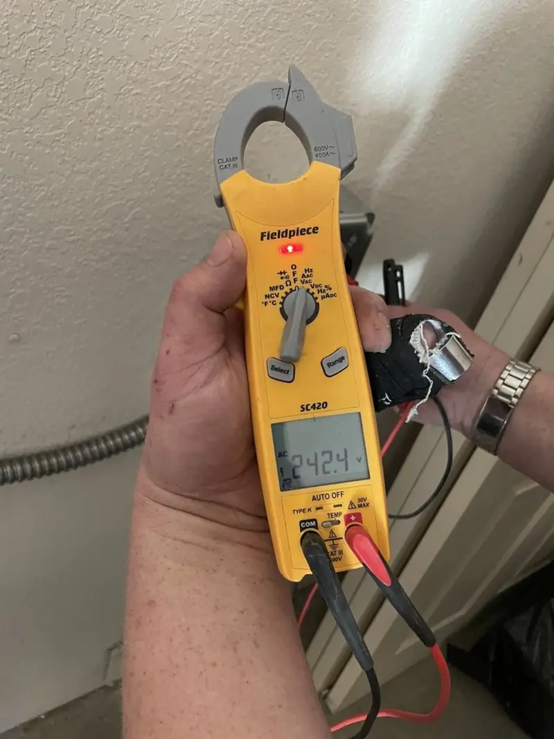 Voltage testing with clamp meter during Aluminum Wiring Replacement in Raisin